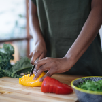 woman cutting peppers