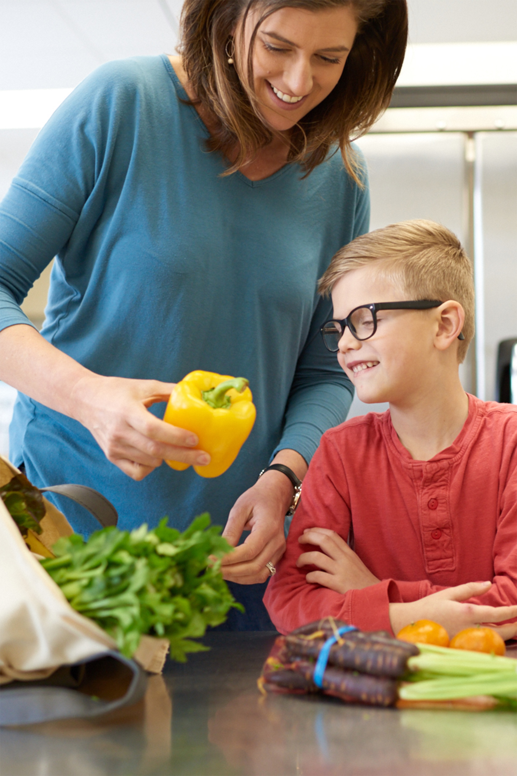 mom-showing-son-yellow-pepper